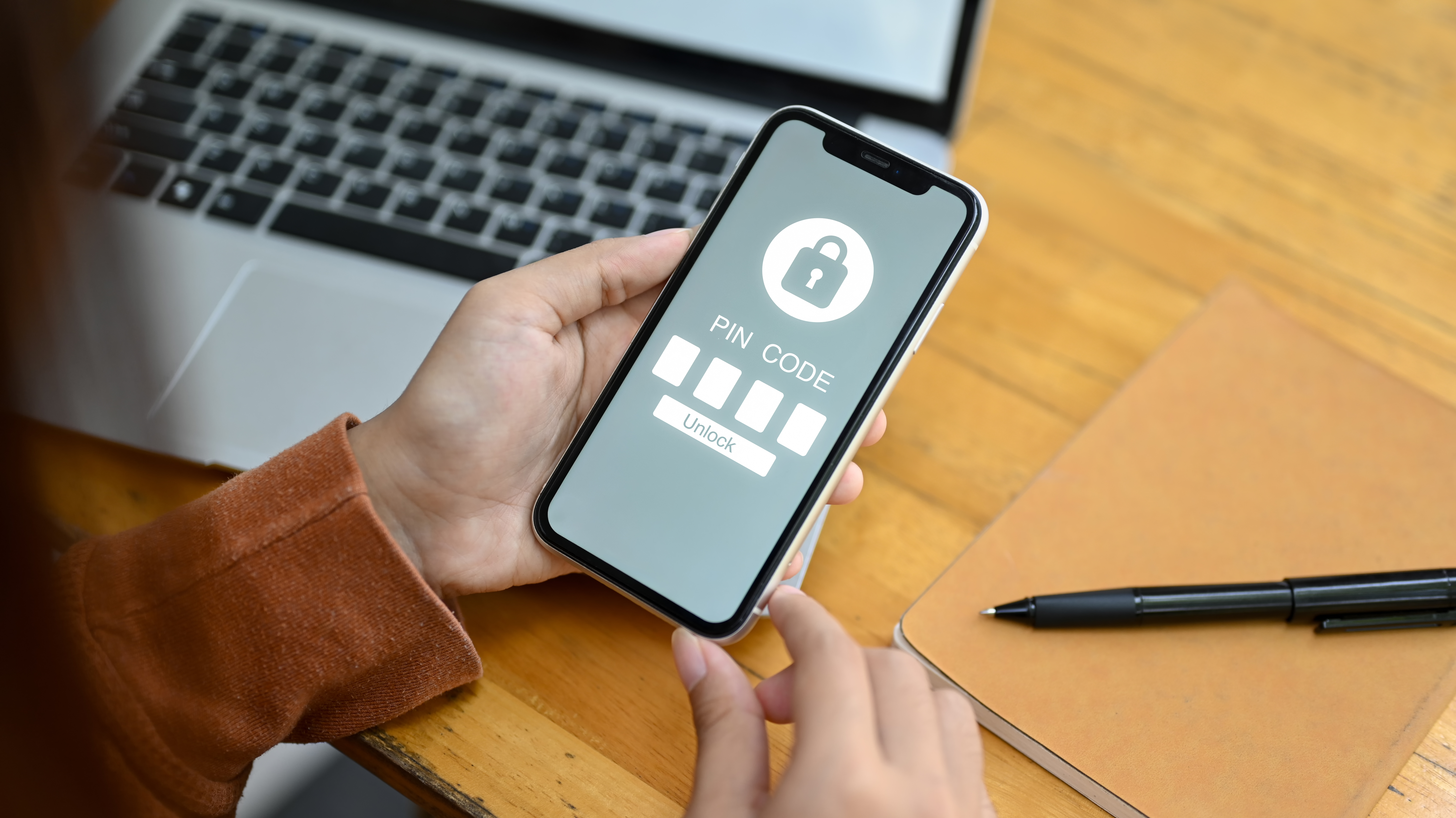 woman-hands-entering-pin-code-smartphone-data-security-concept
